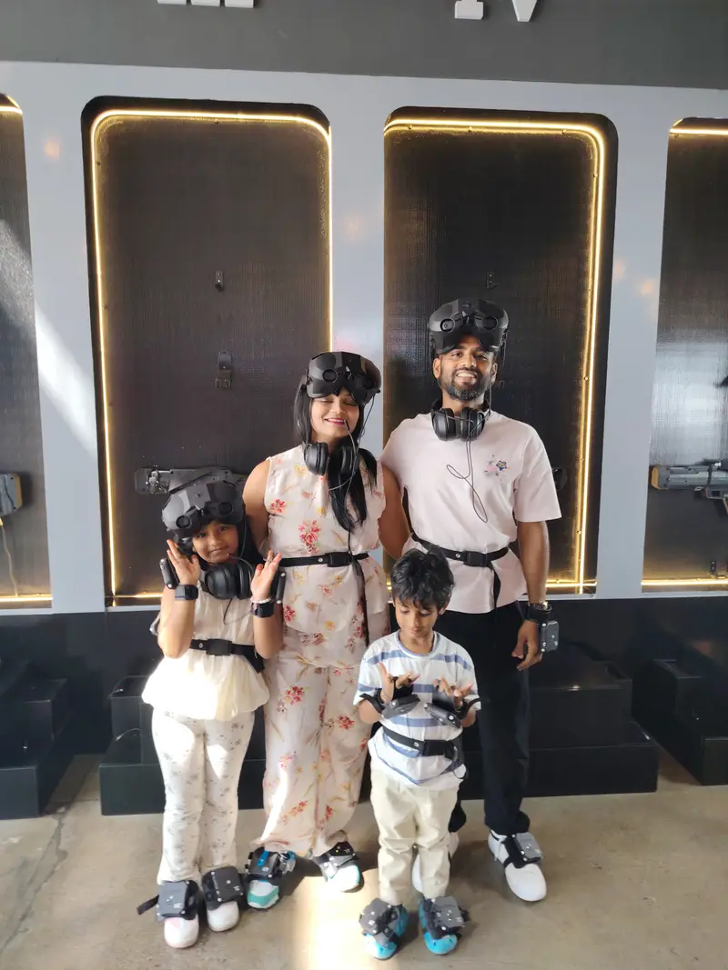 Home 3 Family playing free-roam VR at VR Point Dubai