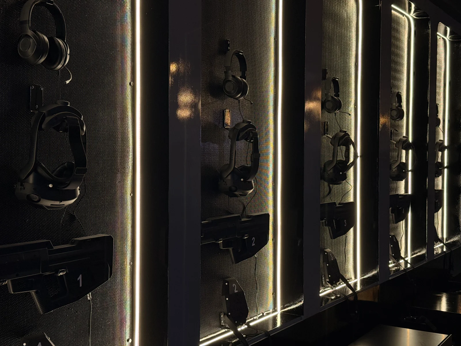 High Voltage 4 VR Point Dubai gear wall with VR headsets