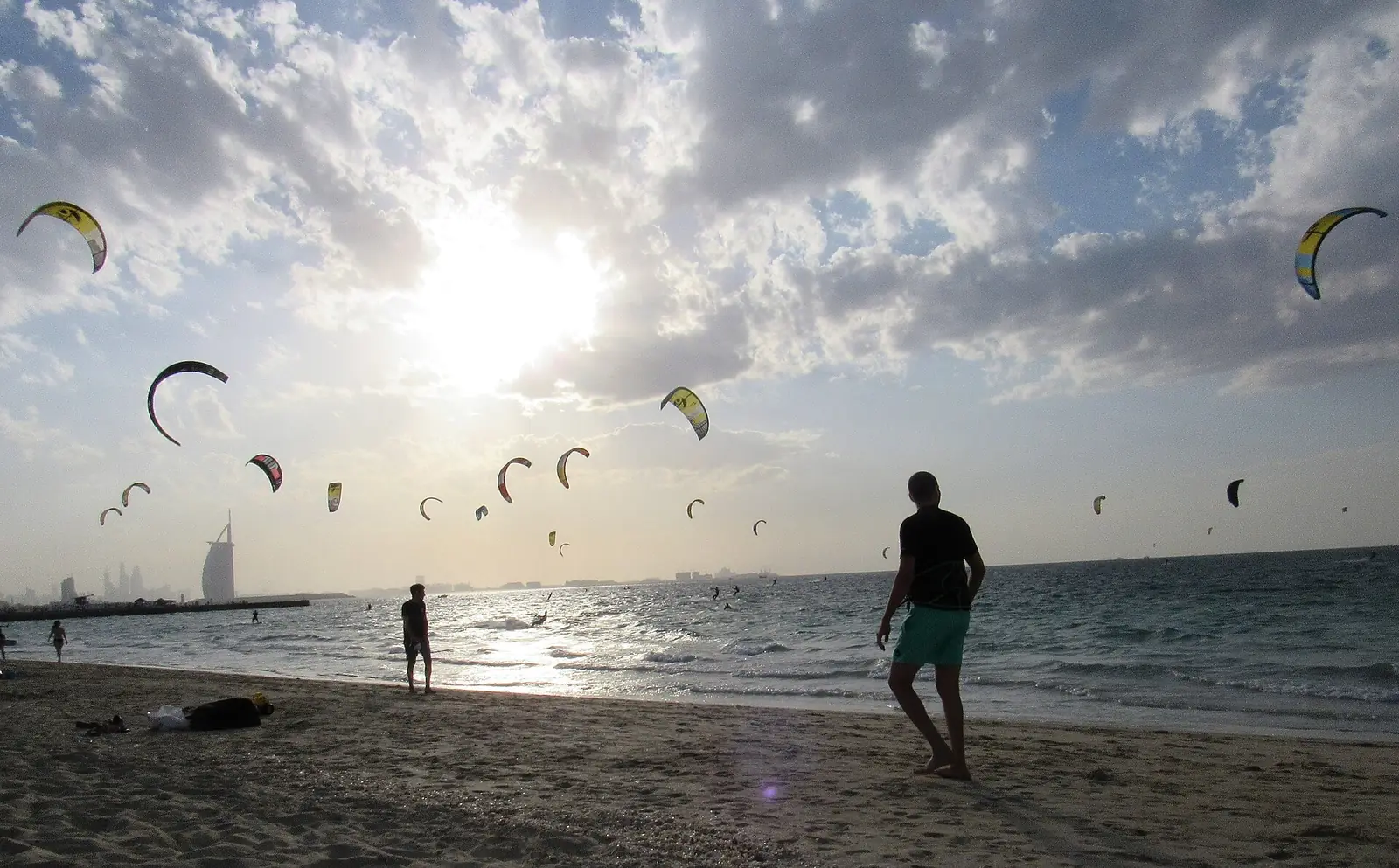 The Best Day in Dubai: A One-Day Itinerary With Every Dirham Counted 20 Kite Beach in Dubai late in the day, kites over the water and the Burj Al Arab on the horizon