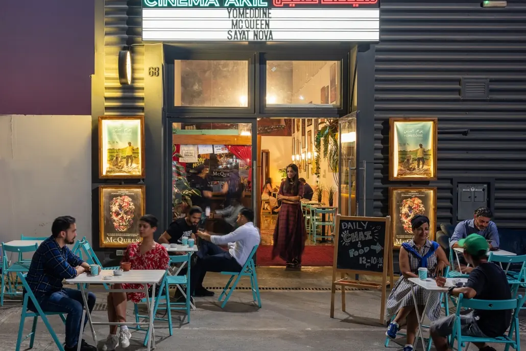 Indoor Activities in Dubai: 30 Places With Real Prices and 4 Ready-Made Days 19 Entrance of Cinema Akil in warehouse 68, Alserkal Avenue, with guests at tables outside
